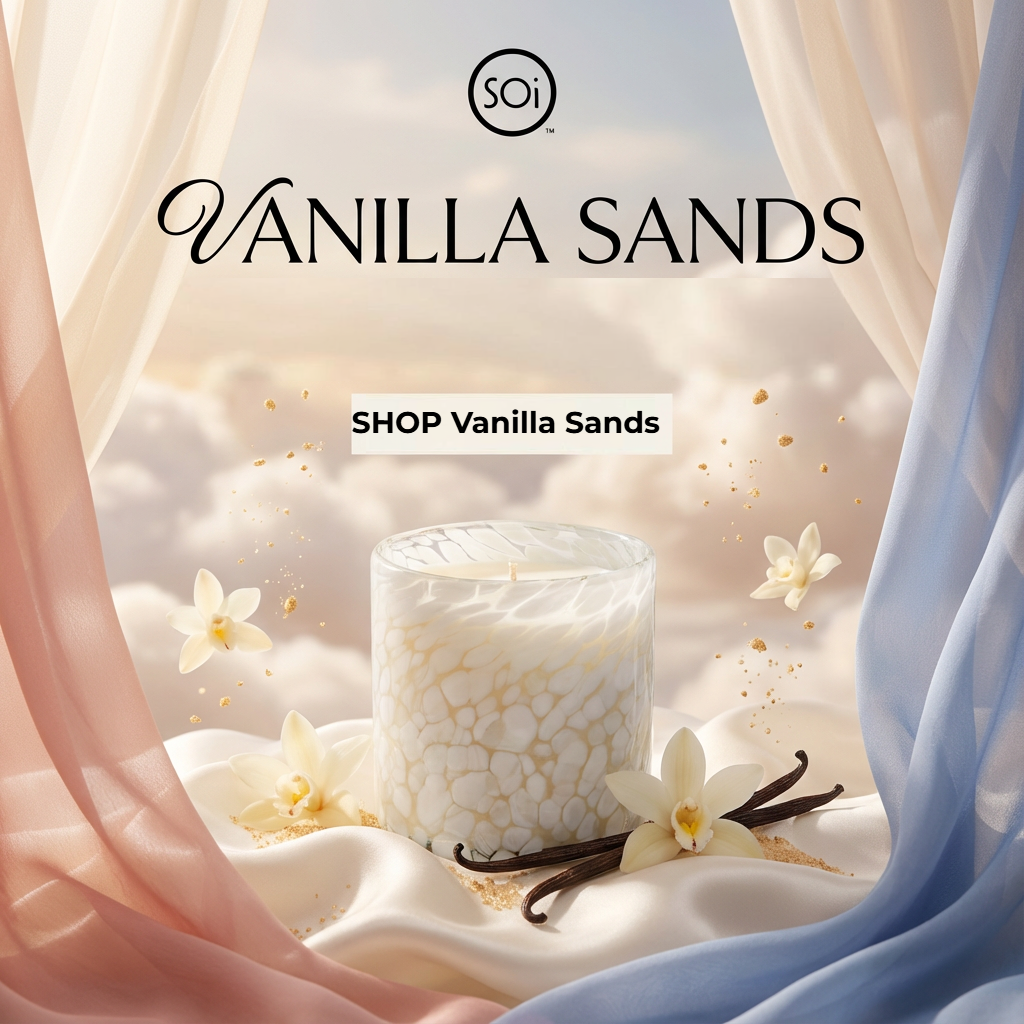 Vanilla Sands candle with vanilla beans and flowers in a soft, blurred background