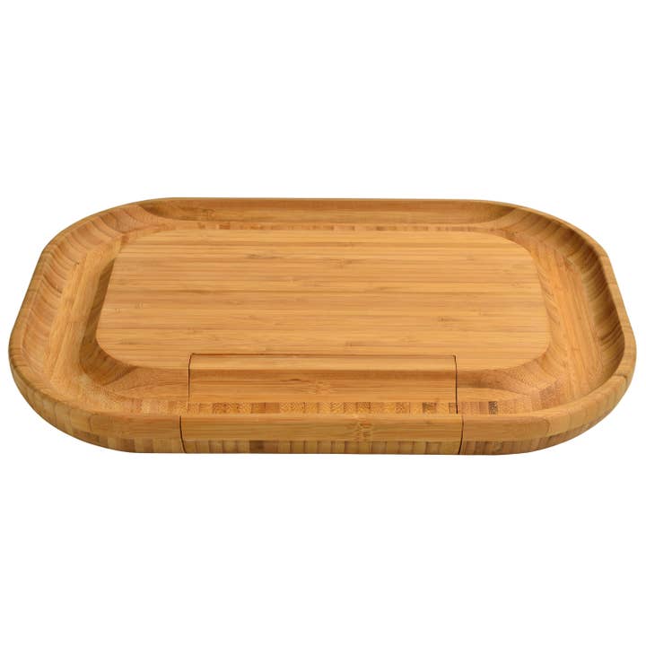 Wooden charcuterie board with a sunken rim on a white background