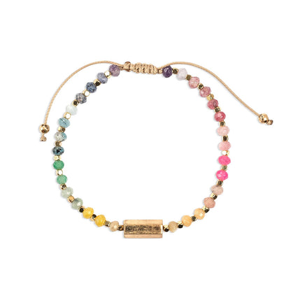 Multicolored beaded bracelet with a gold clasp on a white background