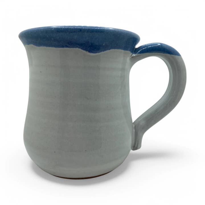 White mug with blue rim on a white background