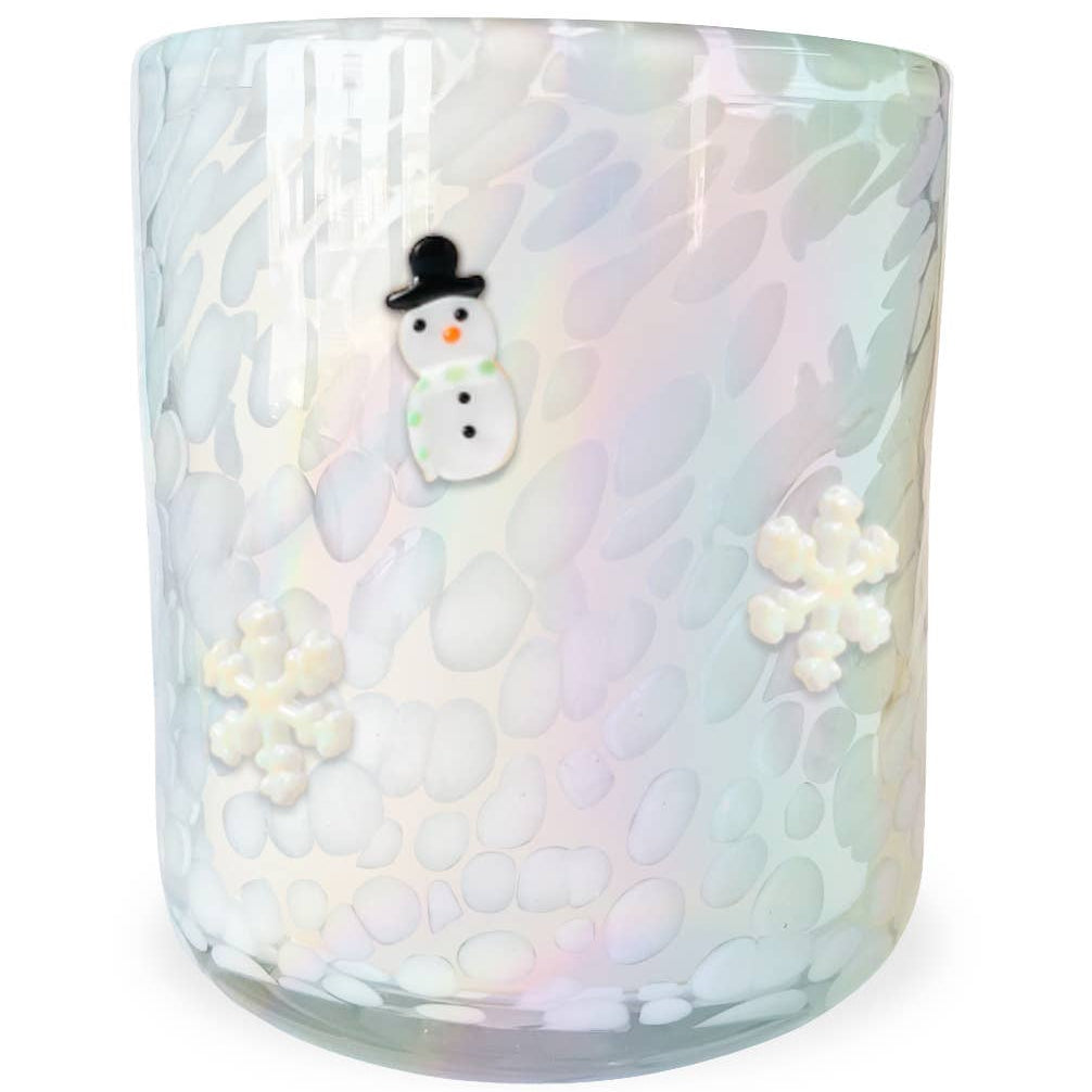 Iridescent glass candle with a snowman decoration on a white background