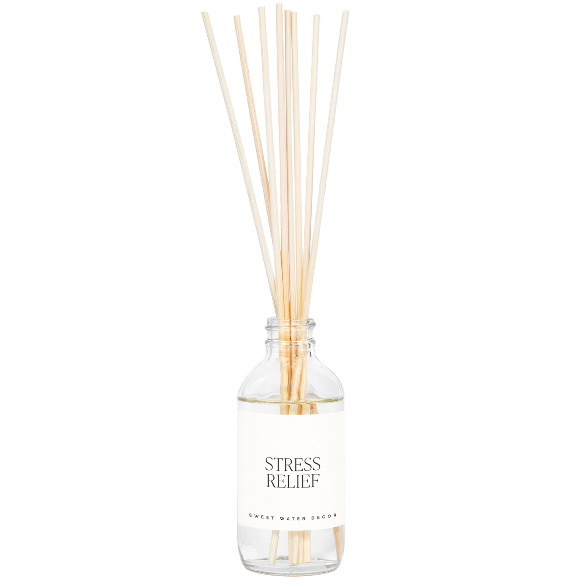 Diffuser bottle labeled 'Stress Relief' with wooden sticks on a white background