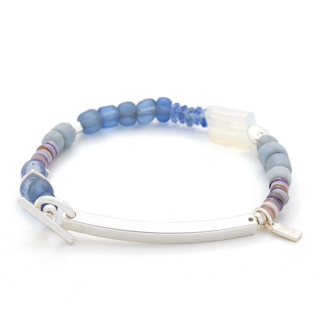 Bracelet with blue and white beads on a white background