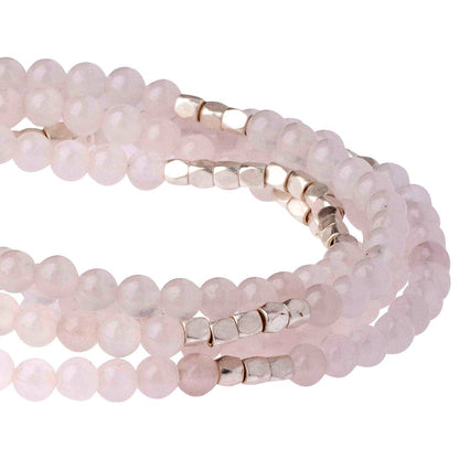 Convertible beaded necklace/wrap bracelet with gold accents on a white background