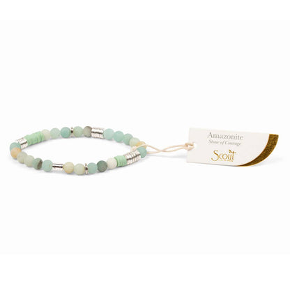 Bracelet with beads and a Scout tag on a white background