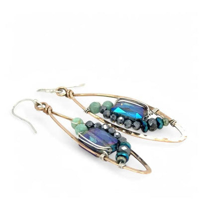 Pair of earrings with gemstones on a white background