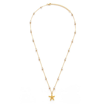 Gold necklace with a starfish pendant on a white background