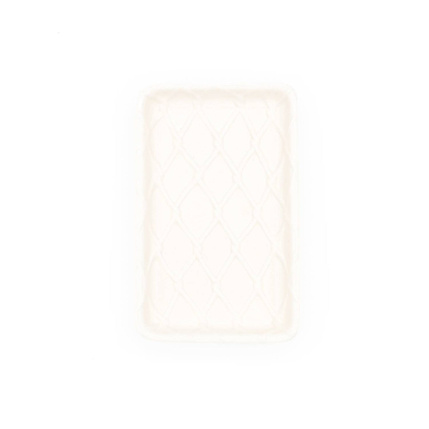 Top view of white soap dish with lattice pattern on a white background.