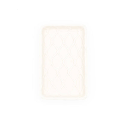 Top view of white soap dish with lattice pattern on a white background.