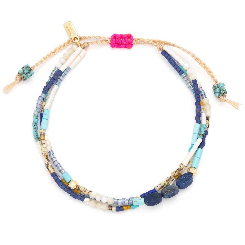 Multistrand beaded bracelet with colorful beads on a white background
