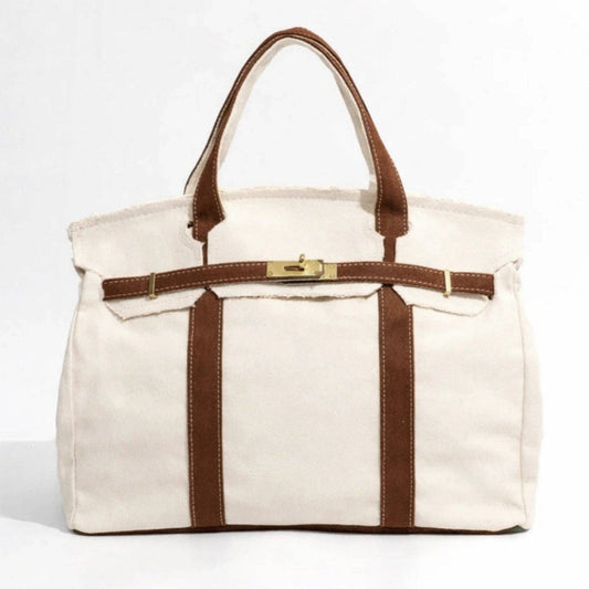Beige tote bag with brown straps on a white background