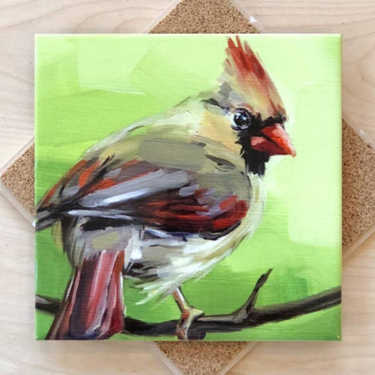 Trivet with a painting of a bird on a green background.