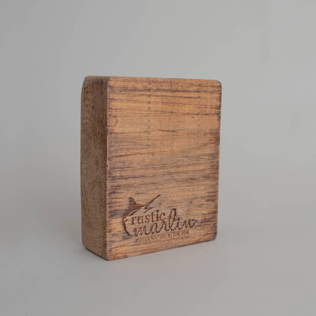 Wooden block with 'Rustic Marin' branding on a gray background