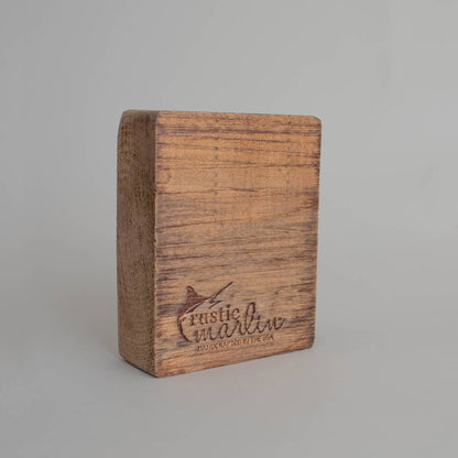 Wooden block with 'Rustic Marin' branding on a gray background