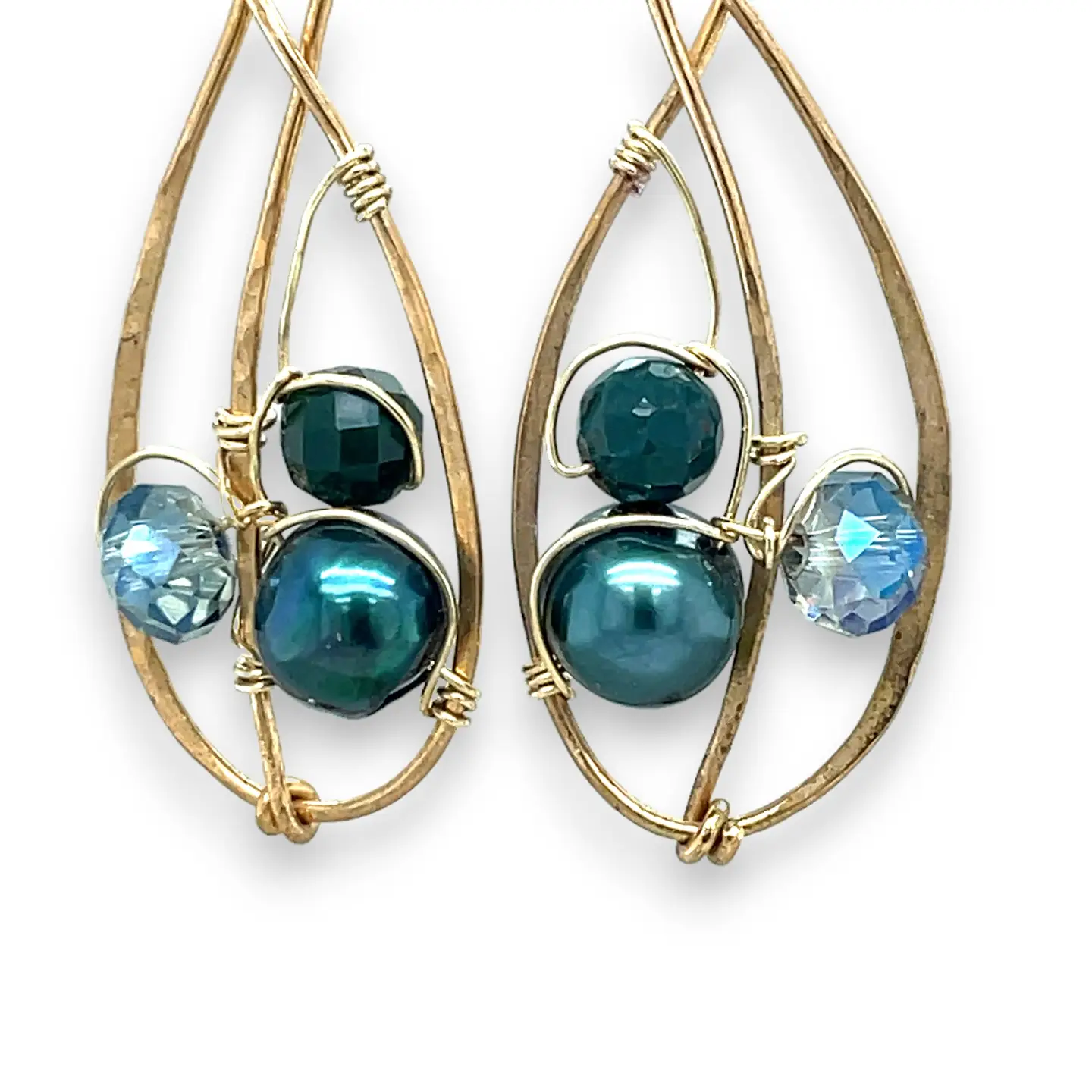 Pair of gold-framed earrings with blue and green beads on a white background