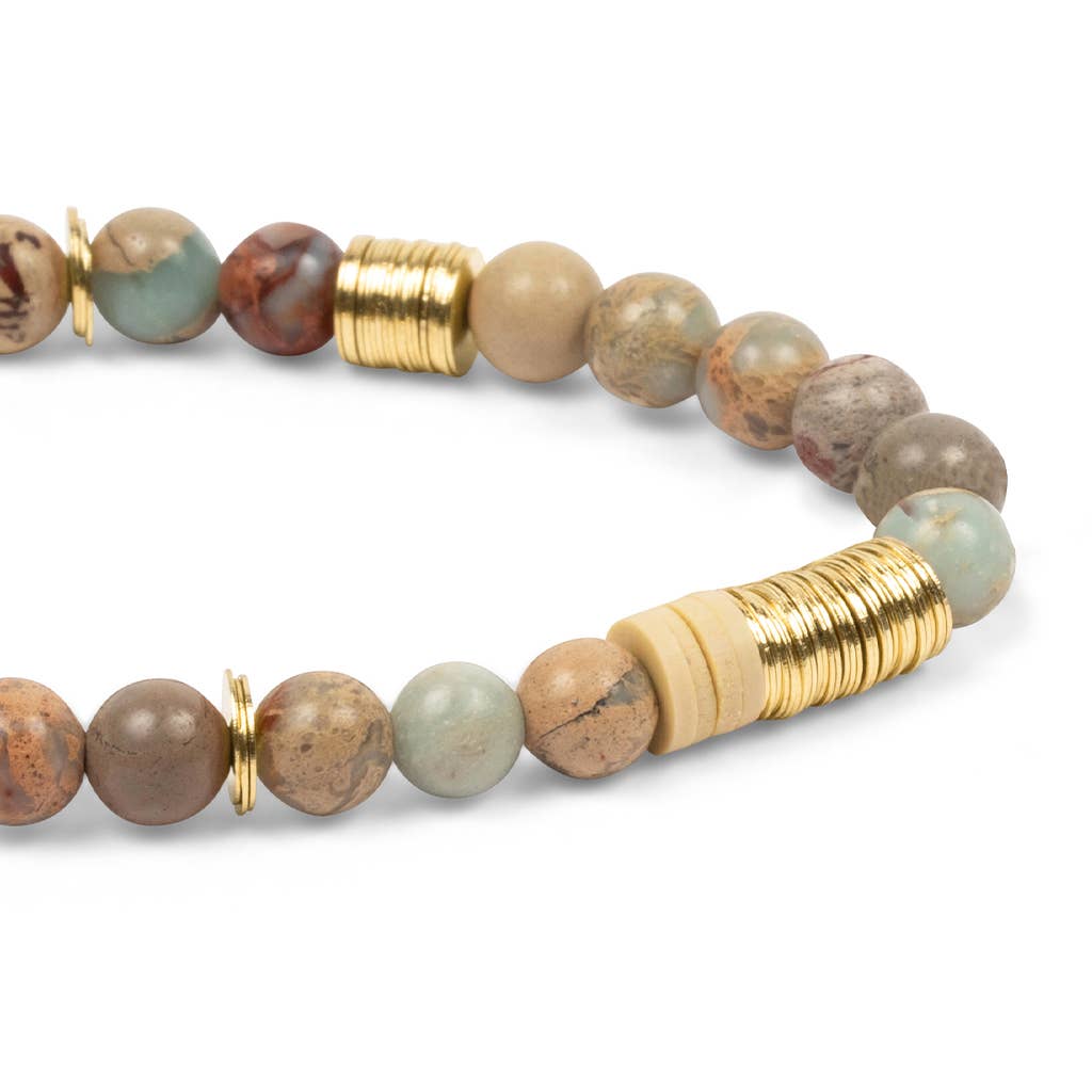 Beaded bracelet with gold accents on a white background