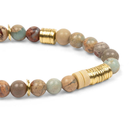 Beaded bracelet with gold accents on a white background
