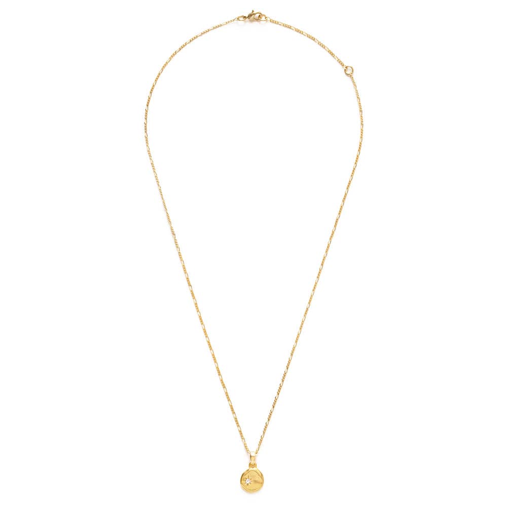 Gold necklace with a small pendant on a white background