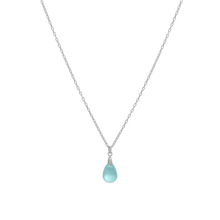 Necklace with a teardrop-shaped aqua pendant on a white background