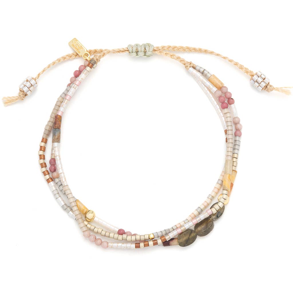 Beaded bracelet with multiple strands on a white background