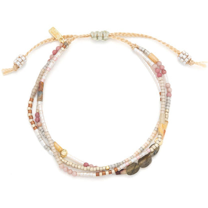 Beaded bracelet with multiple strands on a white background