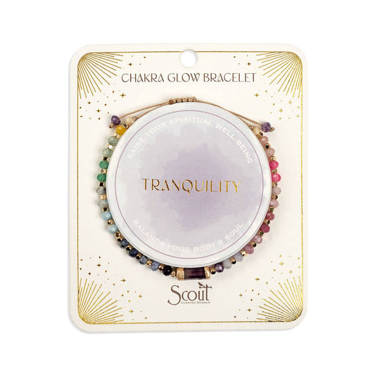 Chakra glow bracelet packaging with 'Tranquility' and 'Scout' branding on a white background. Gallery images show this same piece from multiple angles and in styled settings.
