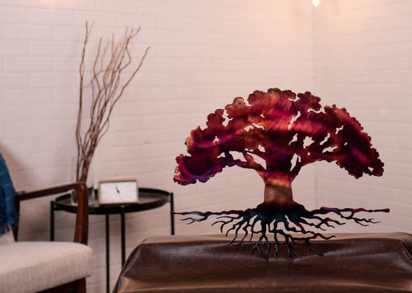 Decorative tree sculpture on a table with a minimal background