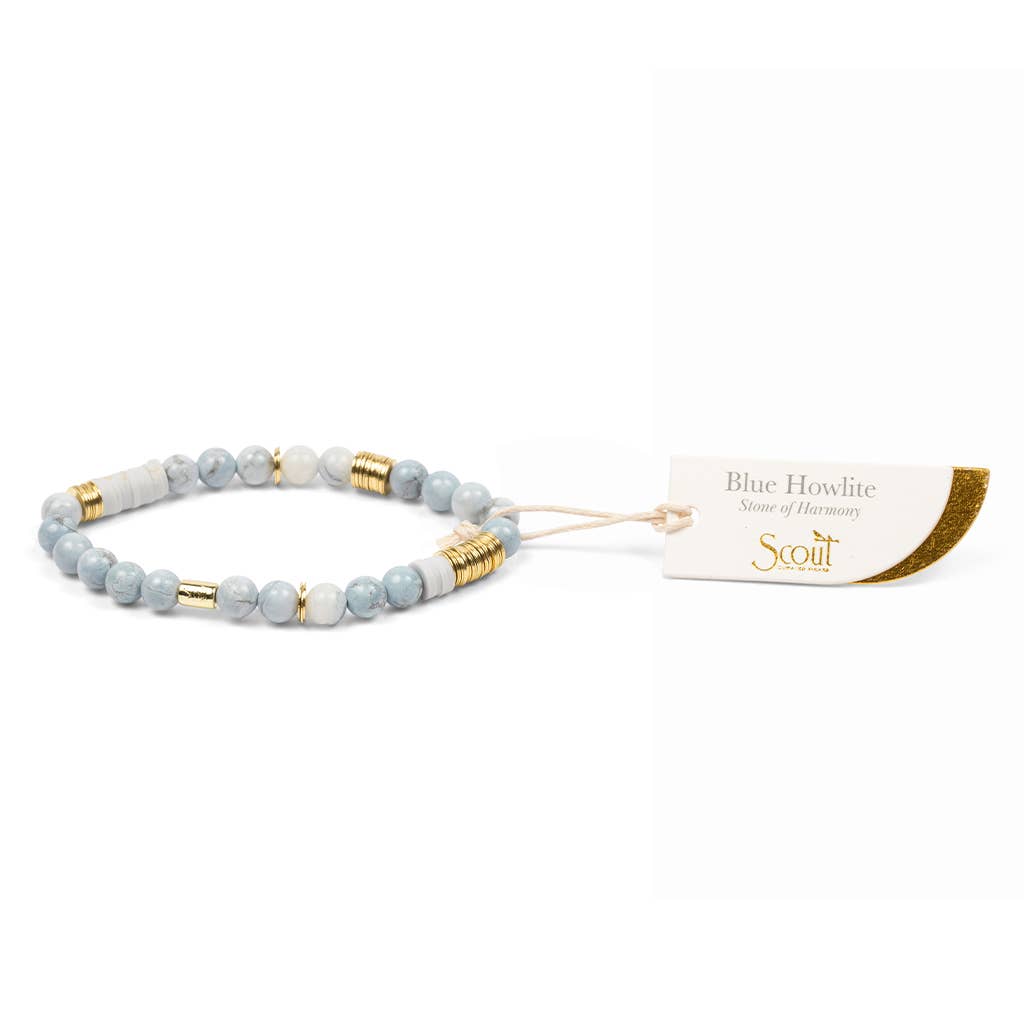 Blue and gold beaded bracelet with a matching tag on a white background