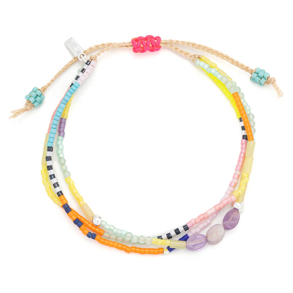 Colorful beaded bracelet with multicolored beads on a white background
