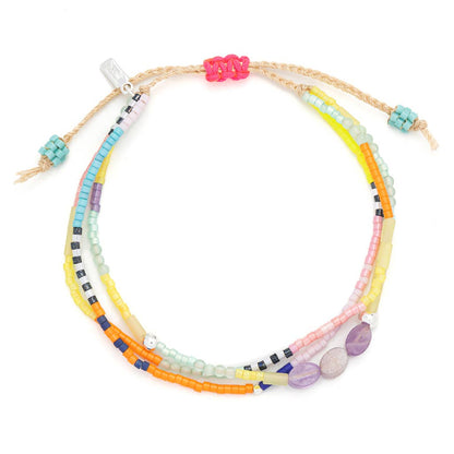 Colorful beaded bracelet with multicolored beads on a white background
