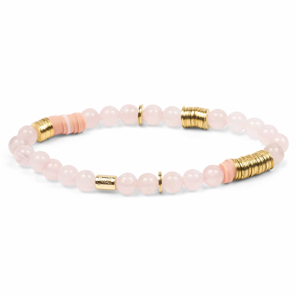 Bracelet with pink beads and gold accents on a white background