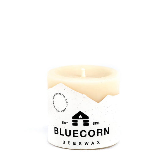 Bluecorn Beeswax white candle on a white background