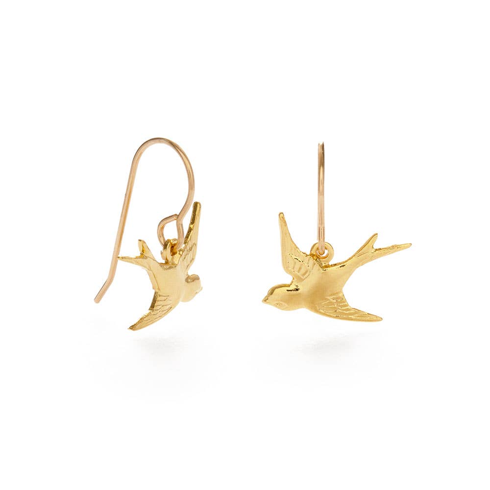Gold bird-shaped earrings on a white background