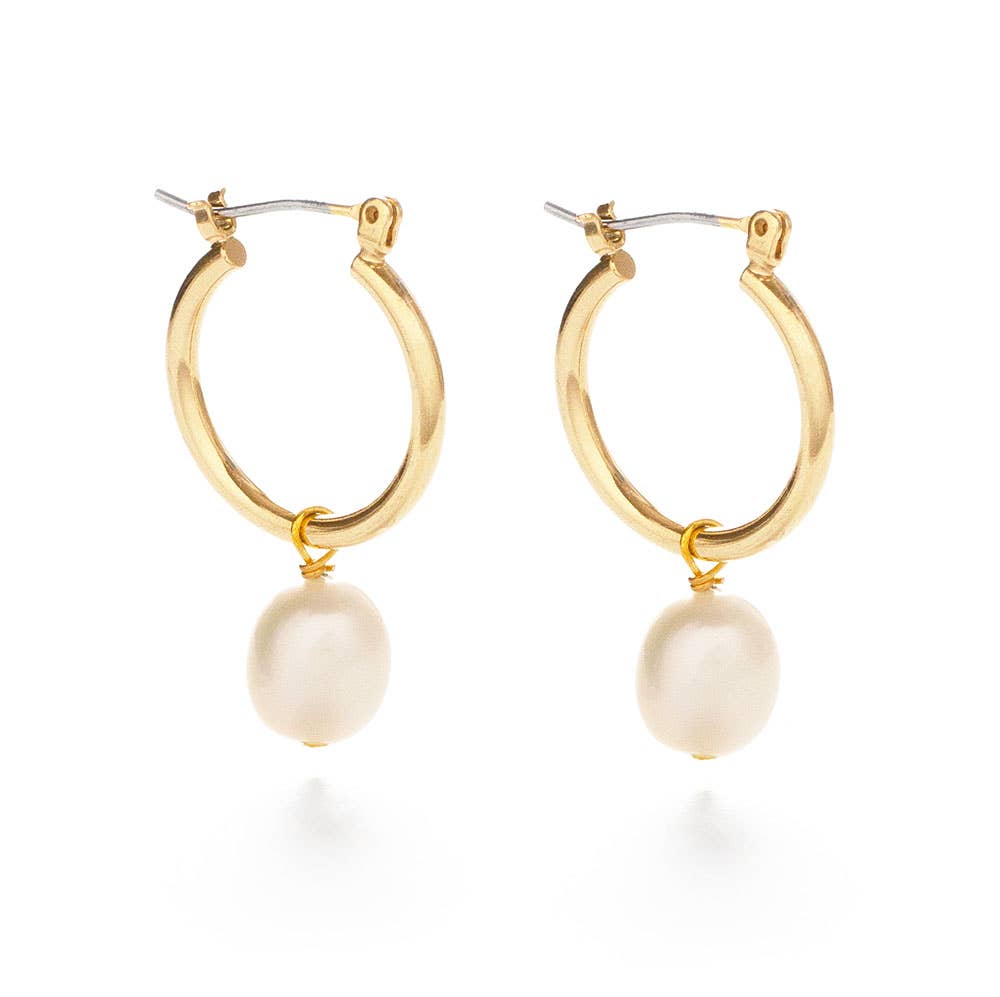 Gold hoop earrings with pearl drops on a white background