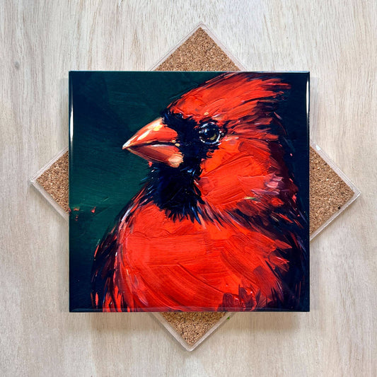 Painting of a red cardinal bird on a wooden surface