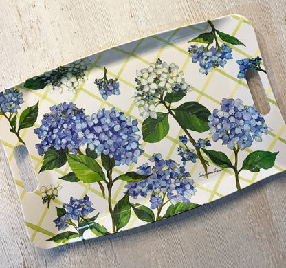 Serving tray with blue floral design on a wooden surface