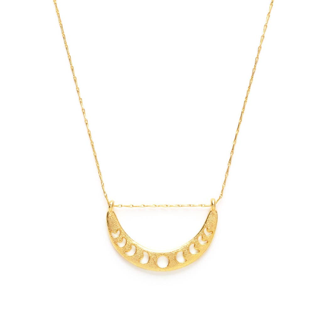 Gold necklace with a half-circle pendant on a white background