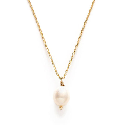 Gold necklace with a single pearl pendant on a white background