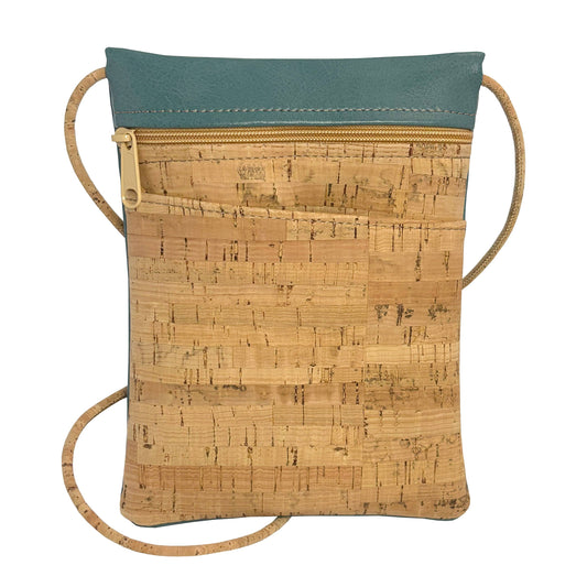 Cork-patterned crossbody bag with teal top section on a white background