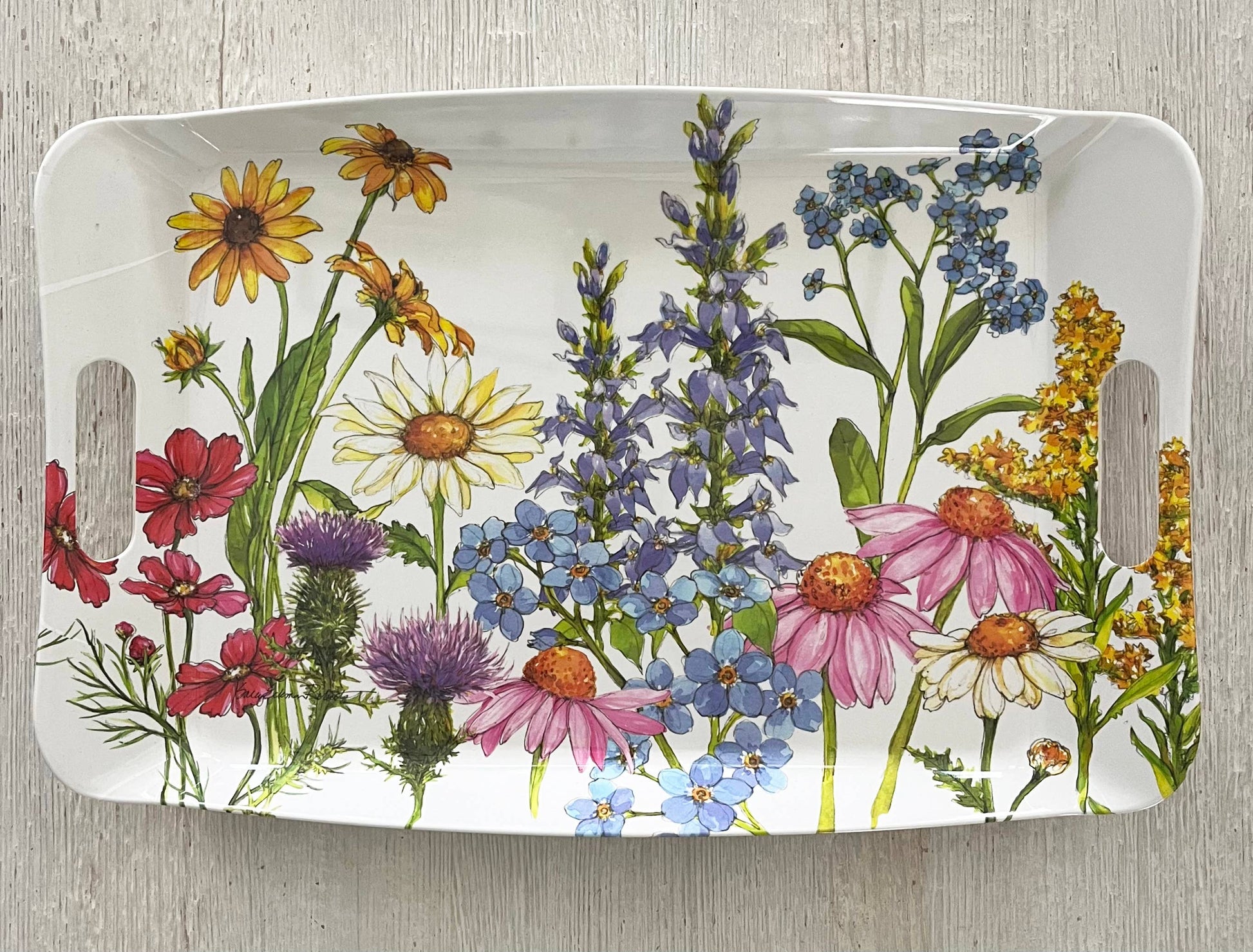 Rectangular tray with a colorful floral design on a wooden surface