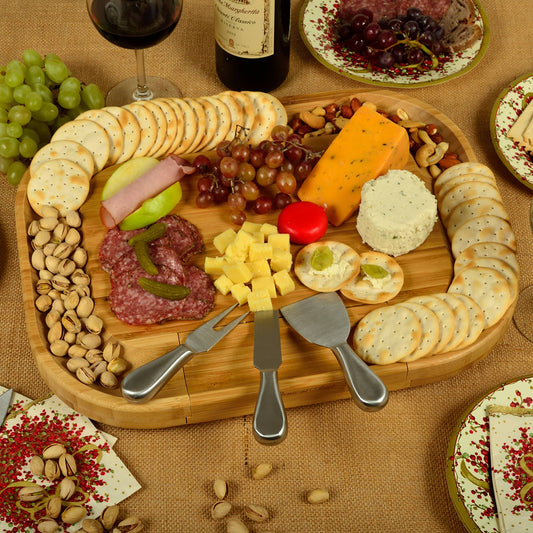 Wooden charcuterie board with assorted cheeses, meats, and crackers on a textured surface.