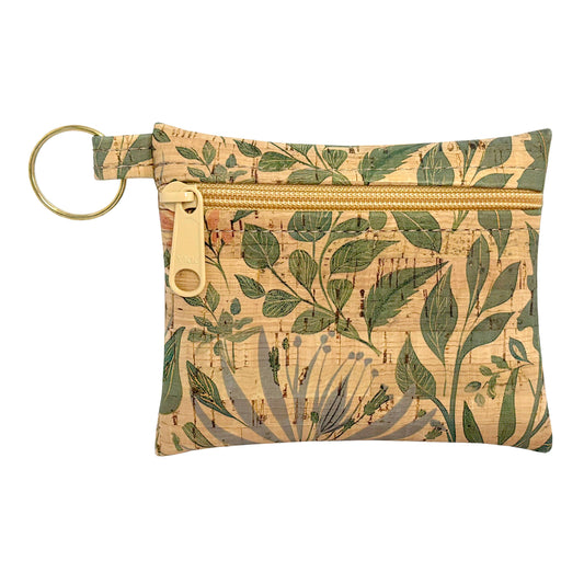 Small pouch with leaf pattern and key ring on a white background