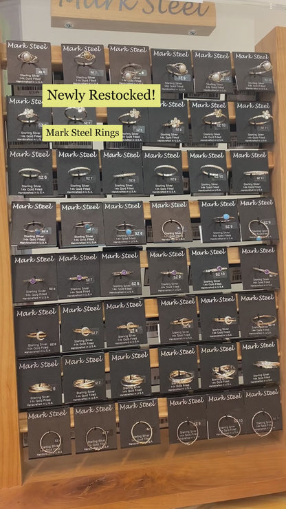 Video of Mark Steel Jewelry rings on display with closeups showcasing various rings. 