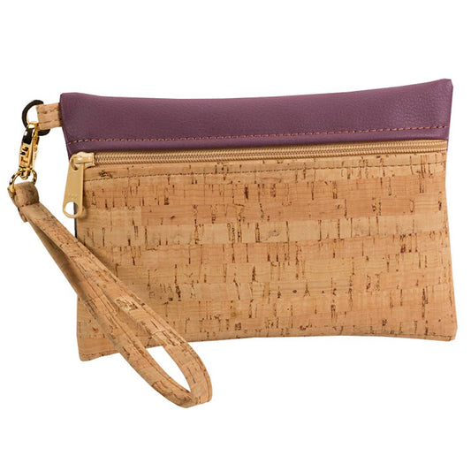 A wristlet zip pouch made from cork fabric with a purple faux leather top, gold hardware, and a removable wristlet strap.