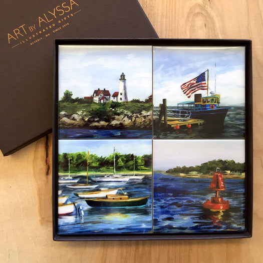 A set of four ceramic tile coasters with nautical-themed images, displayed in a presentation box with the Art by Alyssa logo.